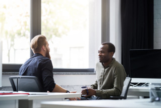 two male colleagues collaborating