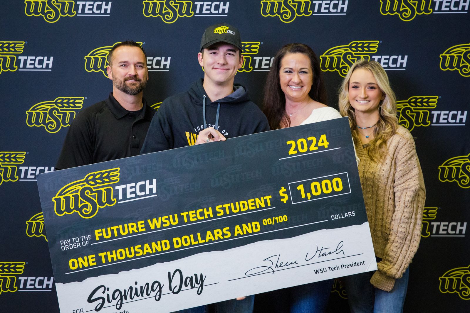 WSU Tech Signing Day 2024 - Family with Check