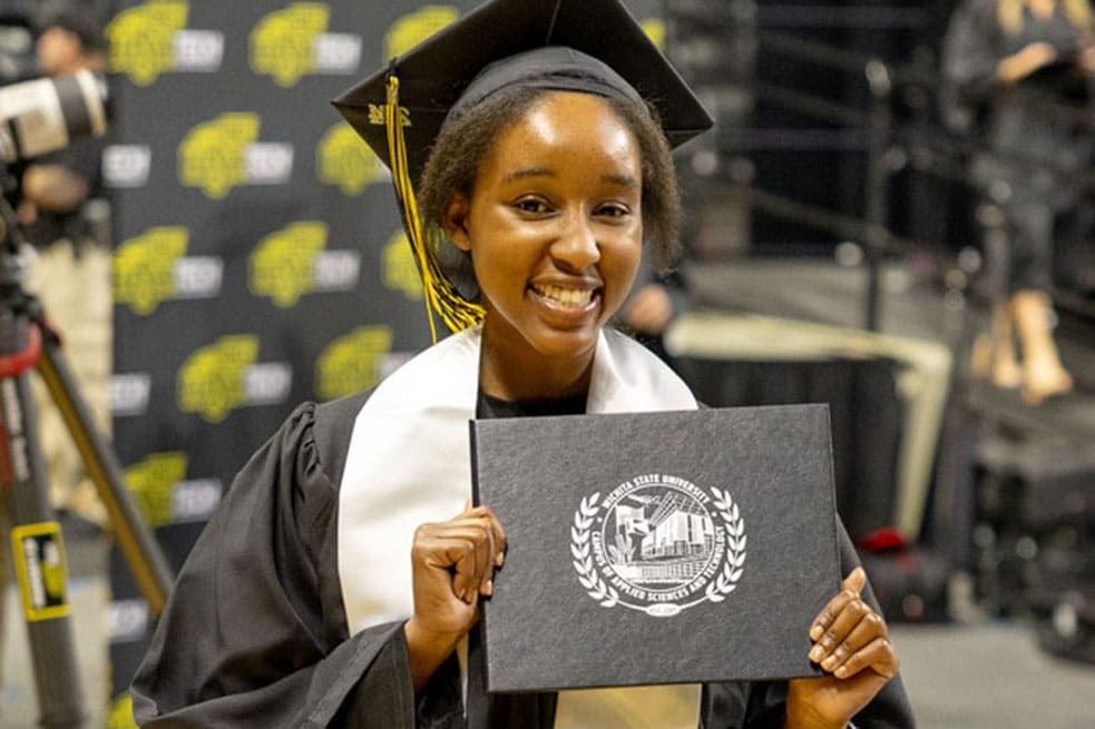 WSU Tech student with diploma at Commencement