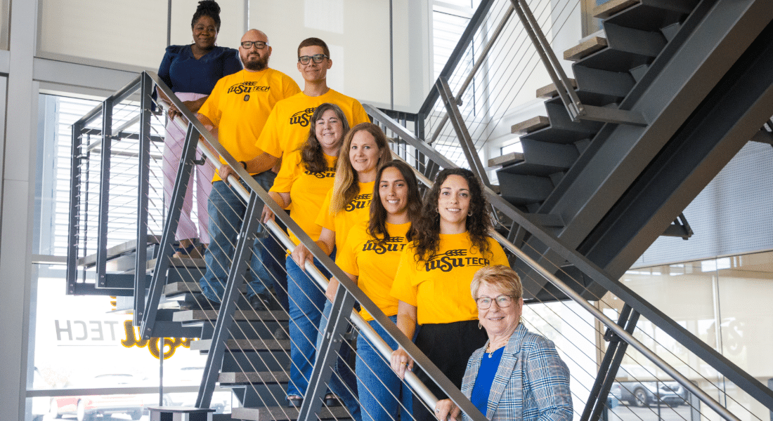 student-resources-hub-presidents-advisory-council Members of the President’s Advisory Council stand together on a campus staircase, representing student leadership, advocacy, and engagement.
