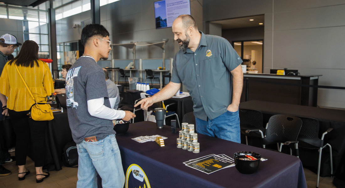 tech-financial-student-resources-hub Student speaks with a Tech Financial representative about financial education and money management resources.