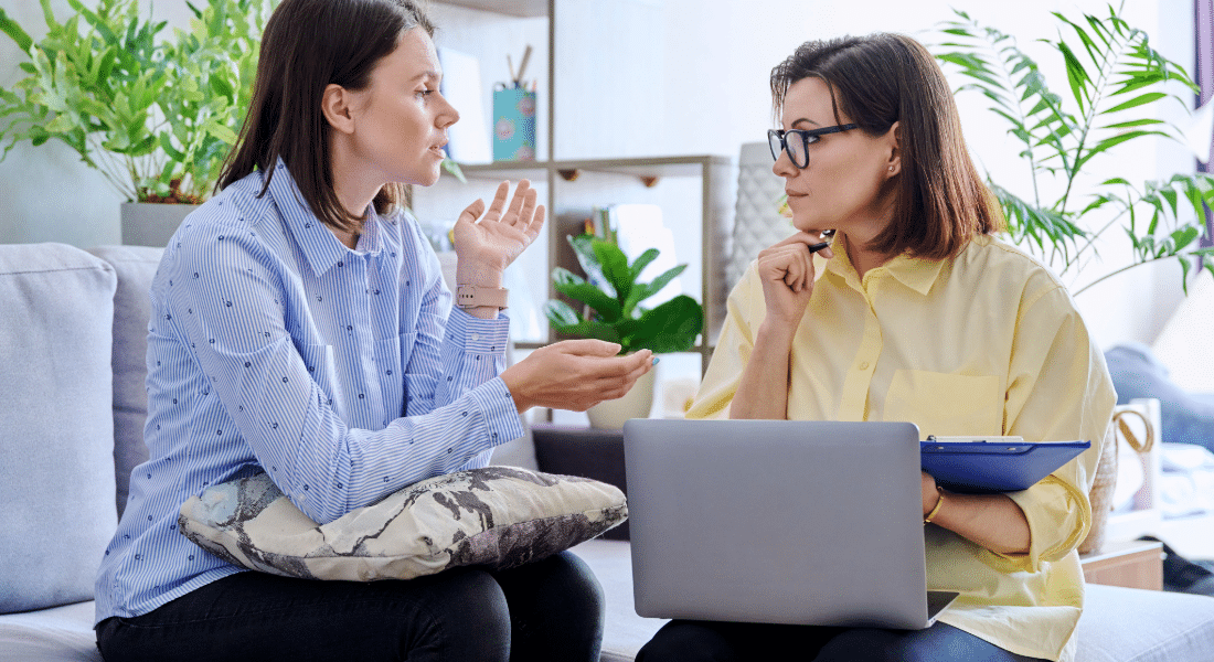 mental-health-services Two people talking during a counseling session.